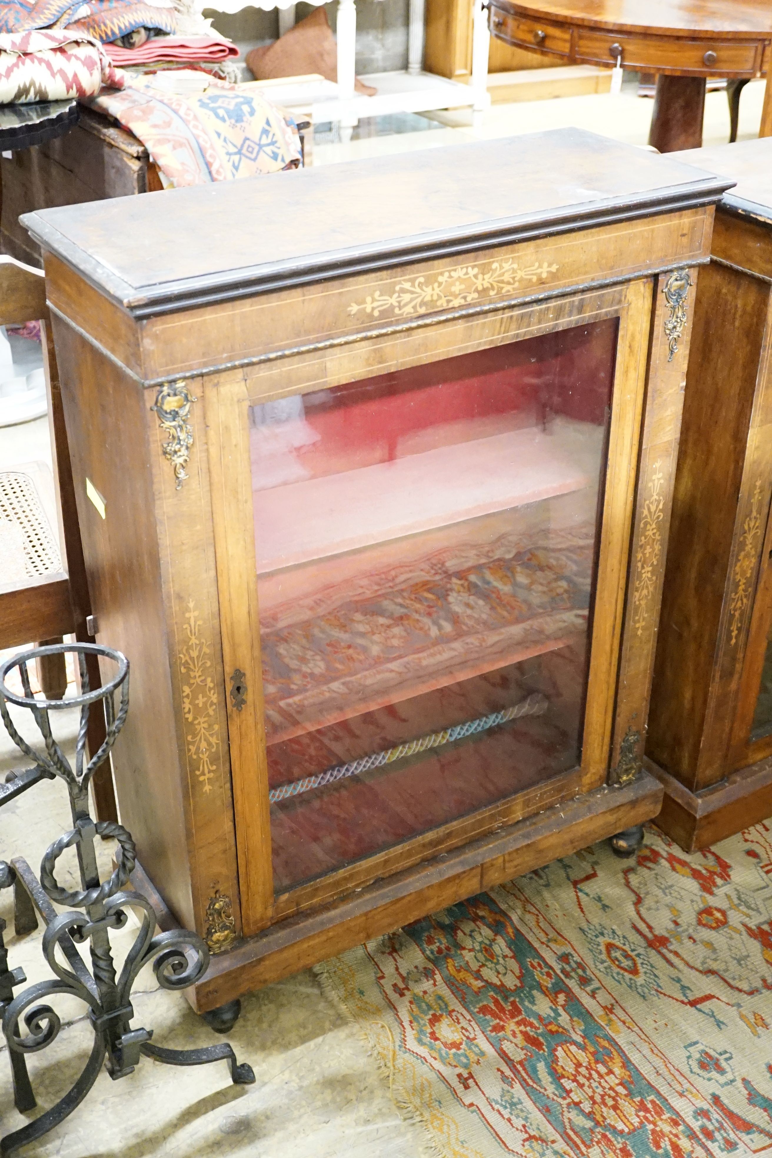 Two similar Victorian walnut and marquetry pier cabinets, the largest 76.5 cm wide, 29 cm deep, 103 cm high